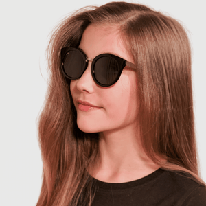 ava wearing mihi kids sunglasses - the madison design