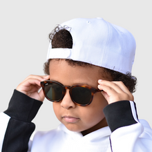 Load image into Gallery viewer, tate wearing mihi kids sunglasses - the bedford design