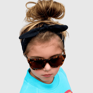 sienna wearing mihi kids sunglasses - the hamptons design 