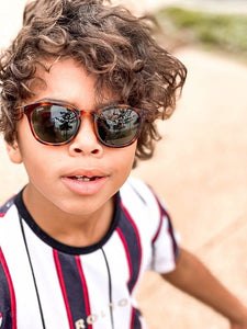 oliver wearing mihi kids sunglasses - the bedford design